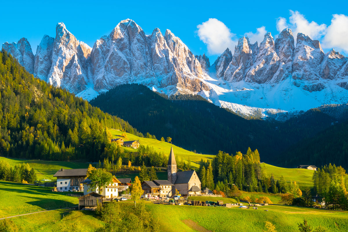 Dolomites and the village of Santa Maddalena (Funes Valley) at sunset