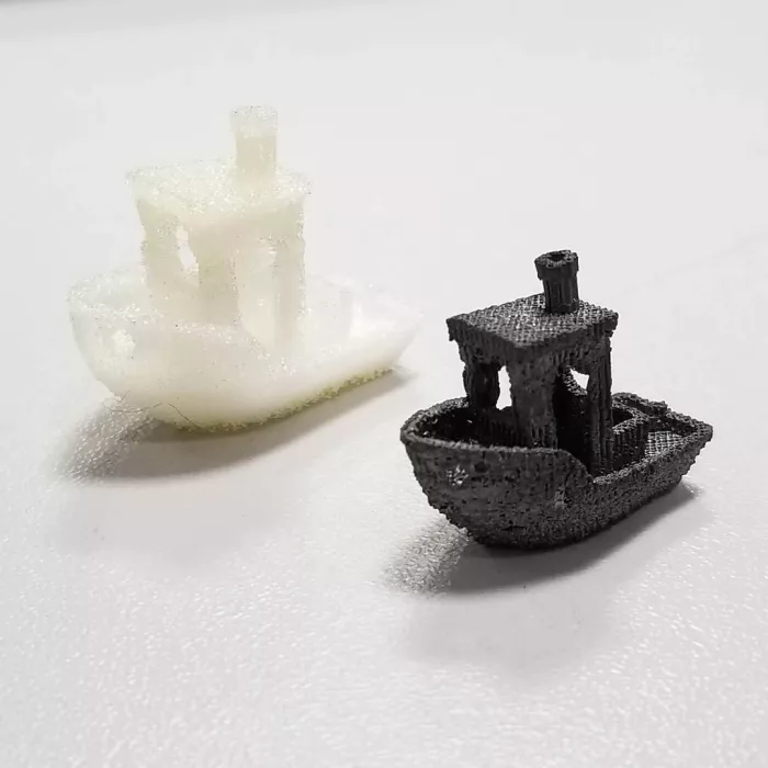 2 little ships, one in white, one in black