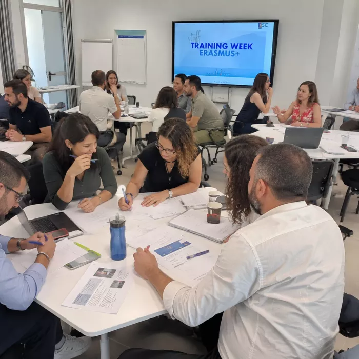 Staff sharing ideas in a training session